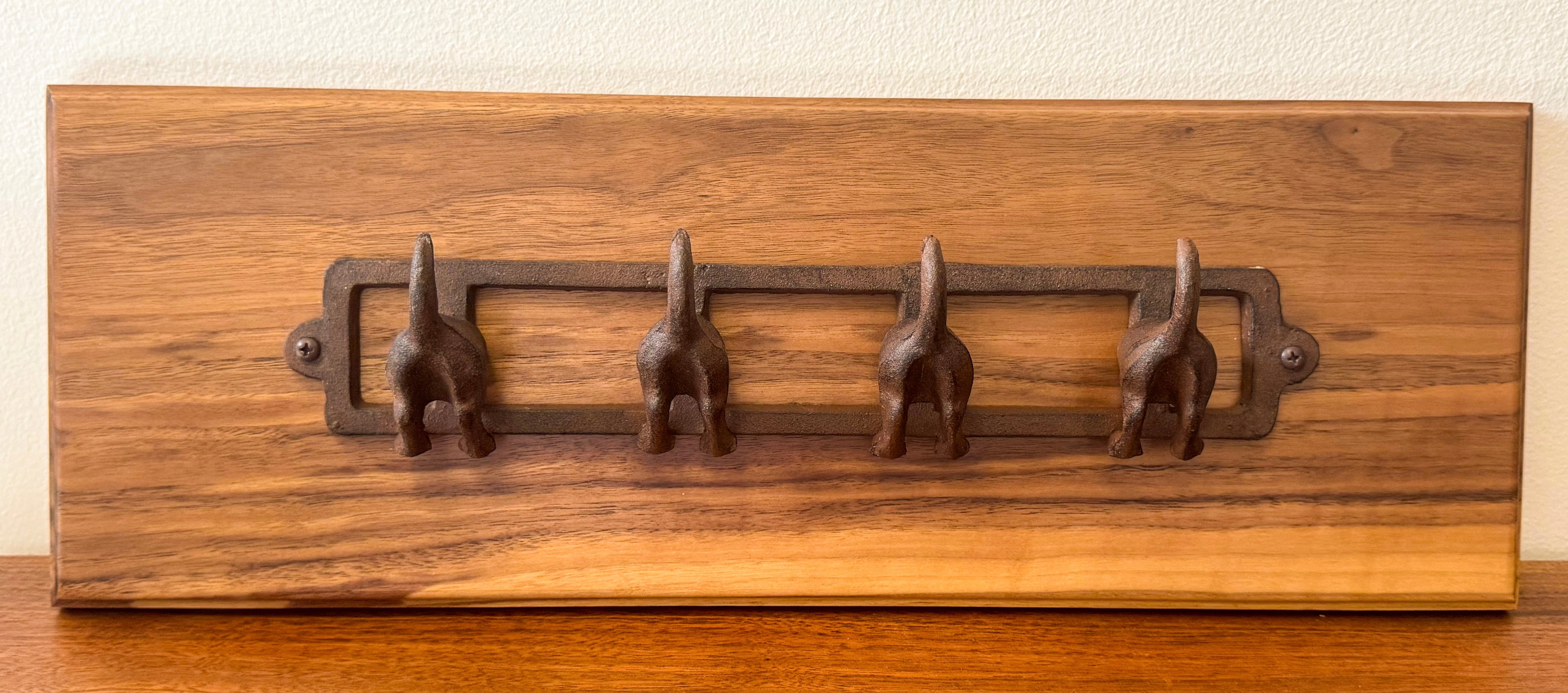 Custom walnut wood wall rack with four cast iron hooks — unique handcrafted wood décor and practical home gift.