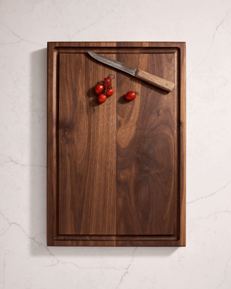 Handmade walnut cutting board with handle – custom wood kitchen board by Refined Surroundings