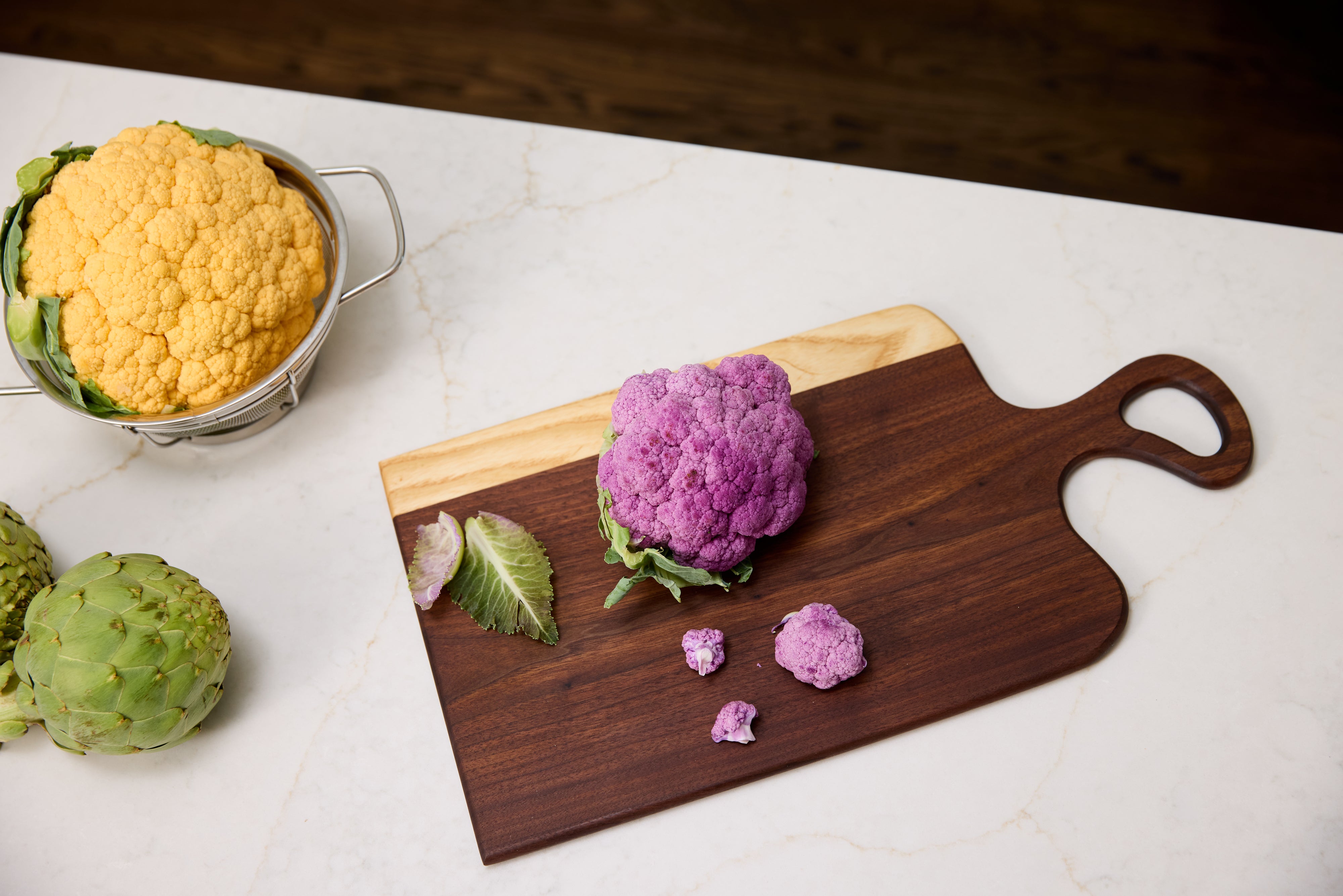 Refined Surroundings walnut cutting board styled with colorful cauliflowers, best non toxic and healthiest cutting board.