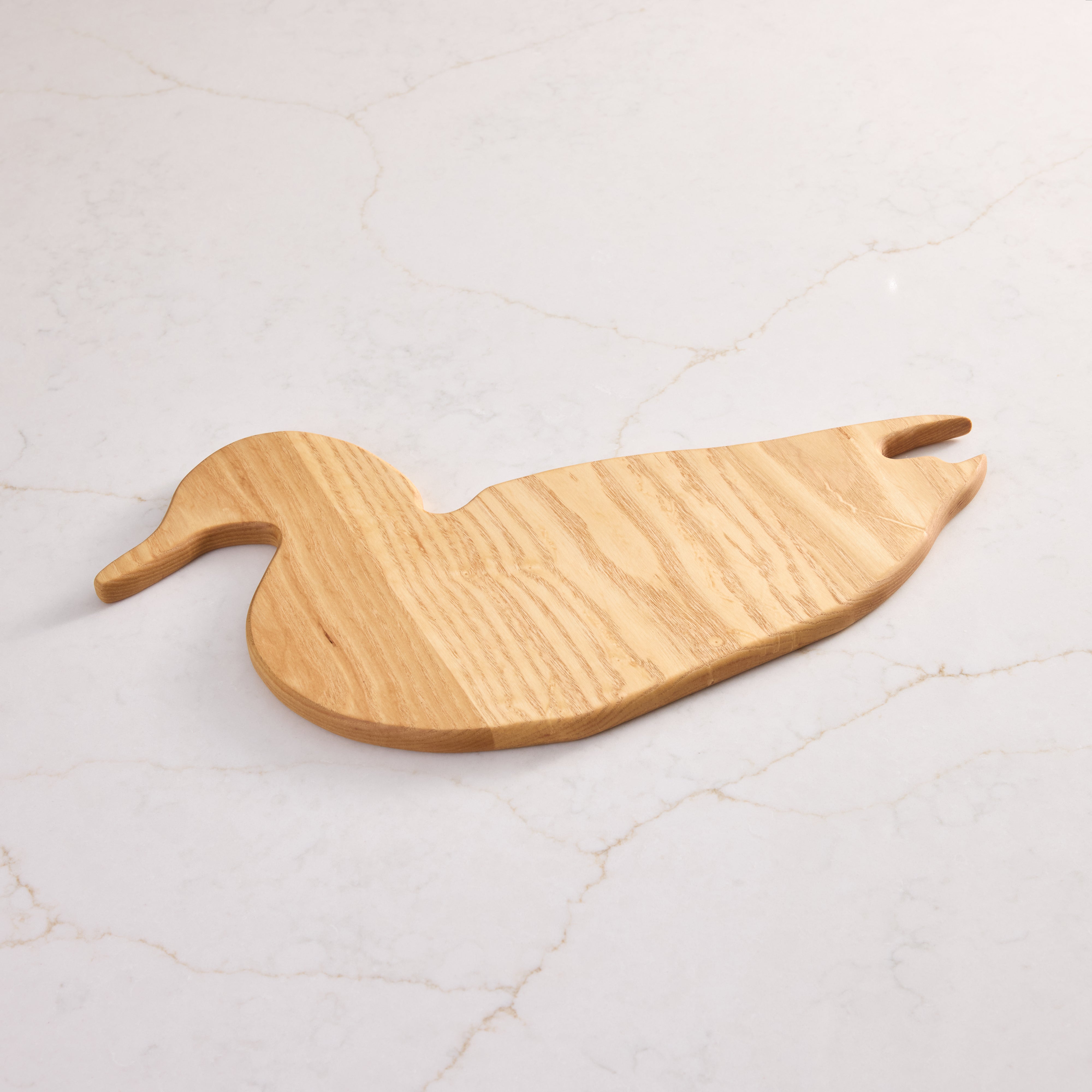 Handcrafted wood charcuterie board made from maple— a unique cutting board design for serving or display.