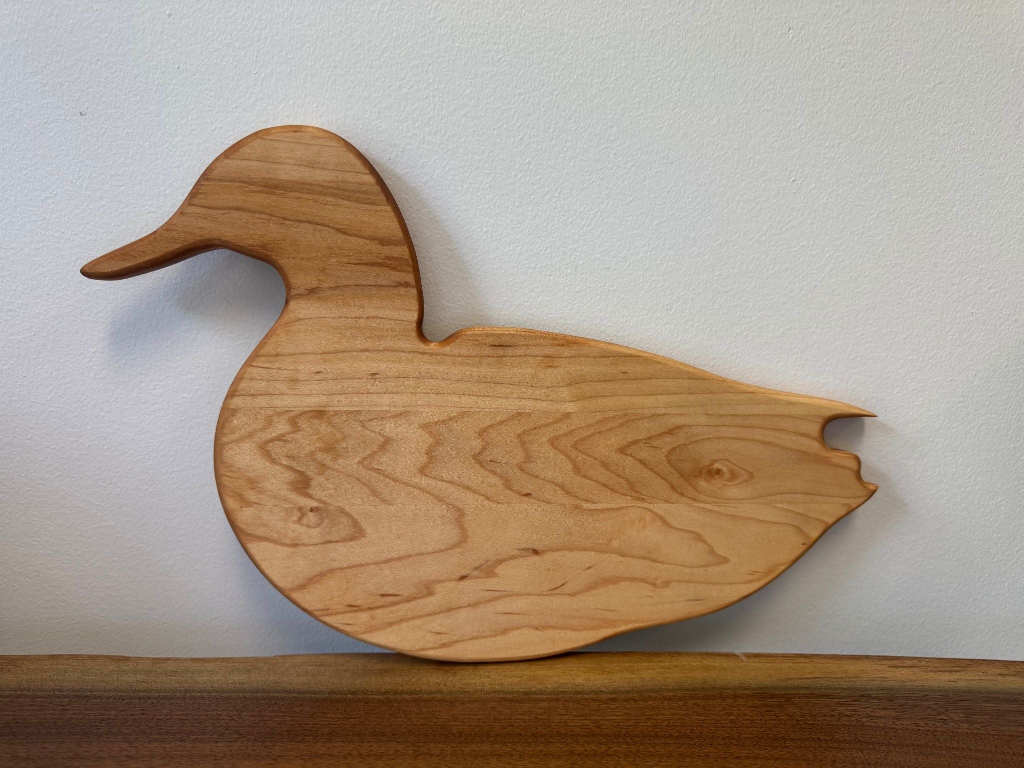 Cherry wood charcuterie cutting board — a unique and non-toxic serving tray for cheese, snacks, or elegant wood decor.